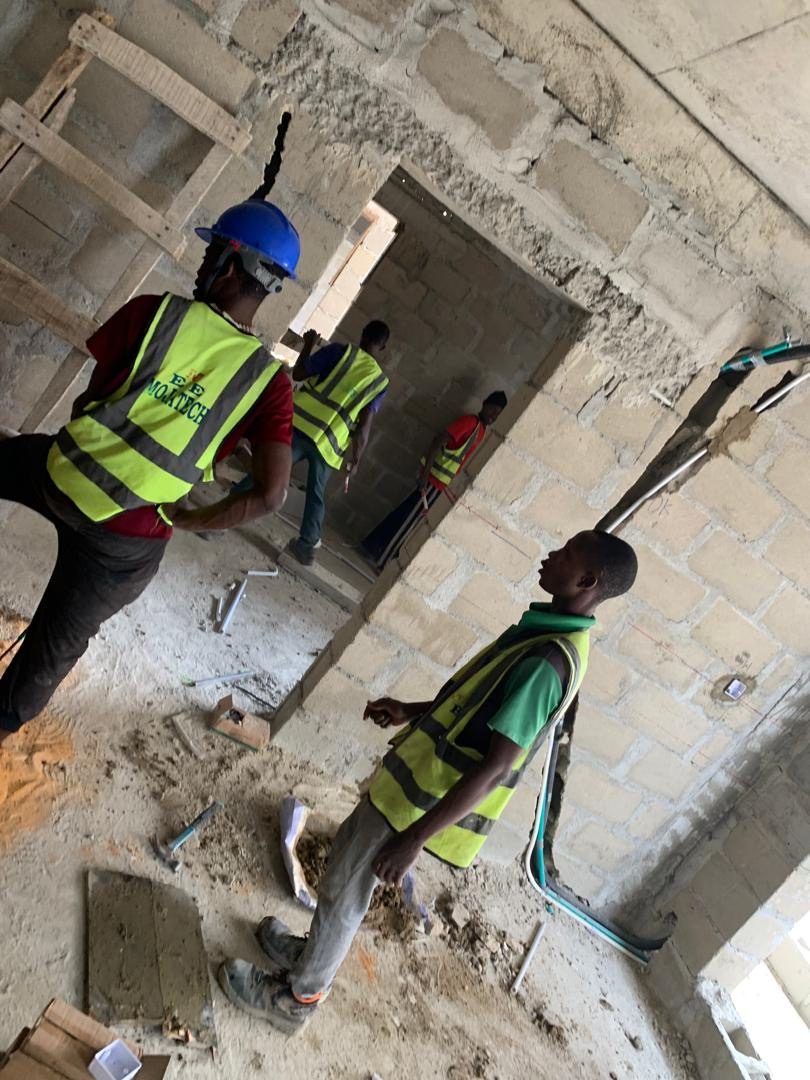 MOJATECH team installing wiring in the FIRS Lagos building
