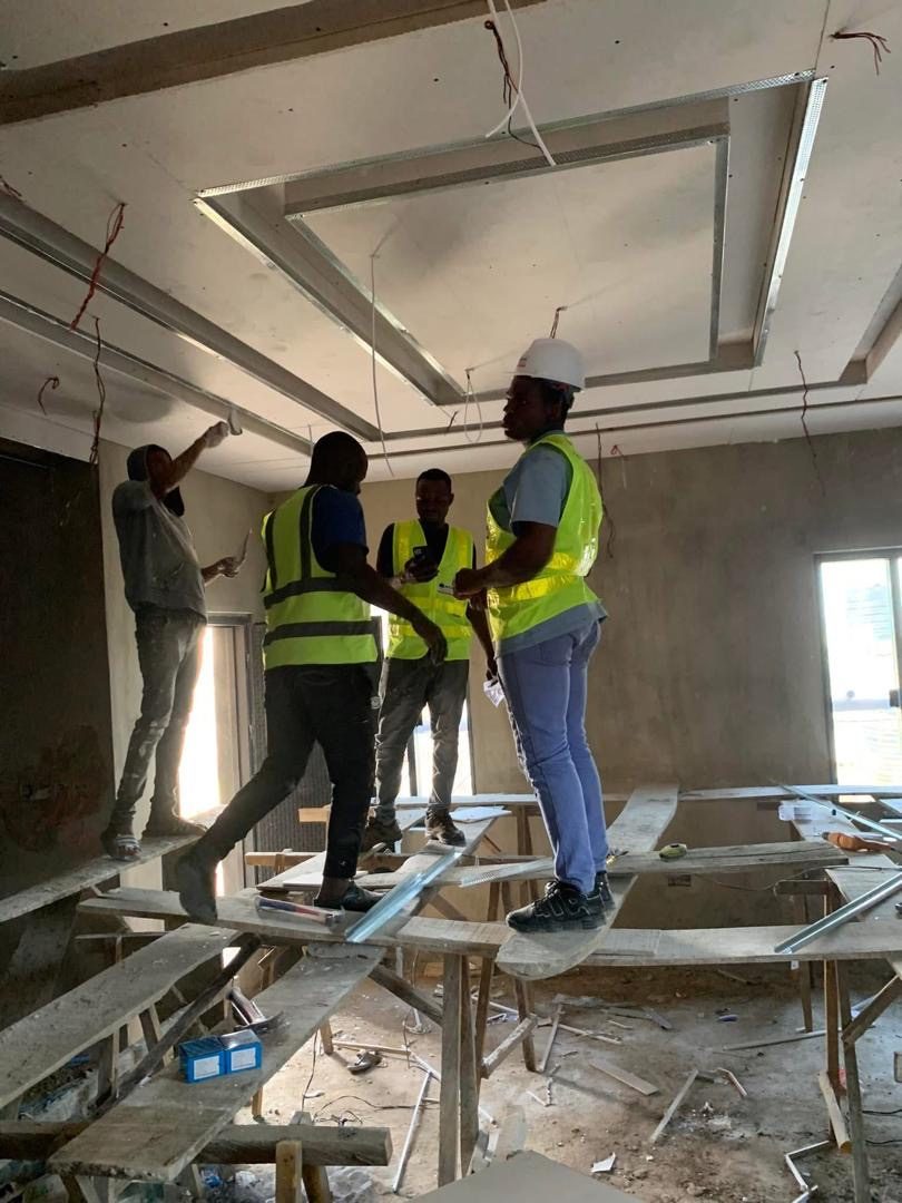 MOJATECH technicians wiring the ceiling of a house in Lagos State
